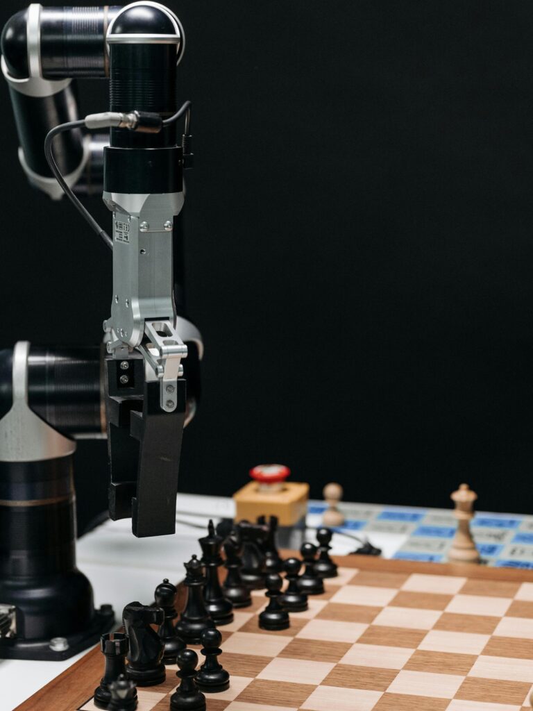 Robotic arm making a strategic move on a chessboard, showcasing AI in games.